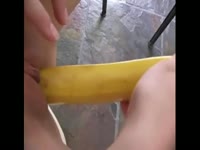 Perfectly shaved teen whore slides an entire banana inside her cunt in this insertion vid